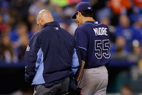 Matt Moore leaves the field after he injured himself ls in the fifth inning Monday night. (Photo by Ed Zurga/Getty Images)
